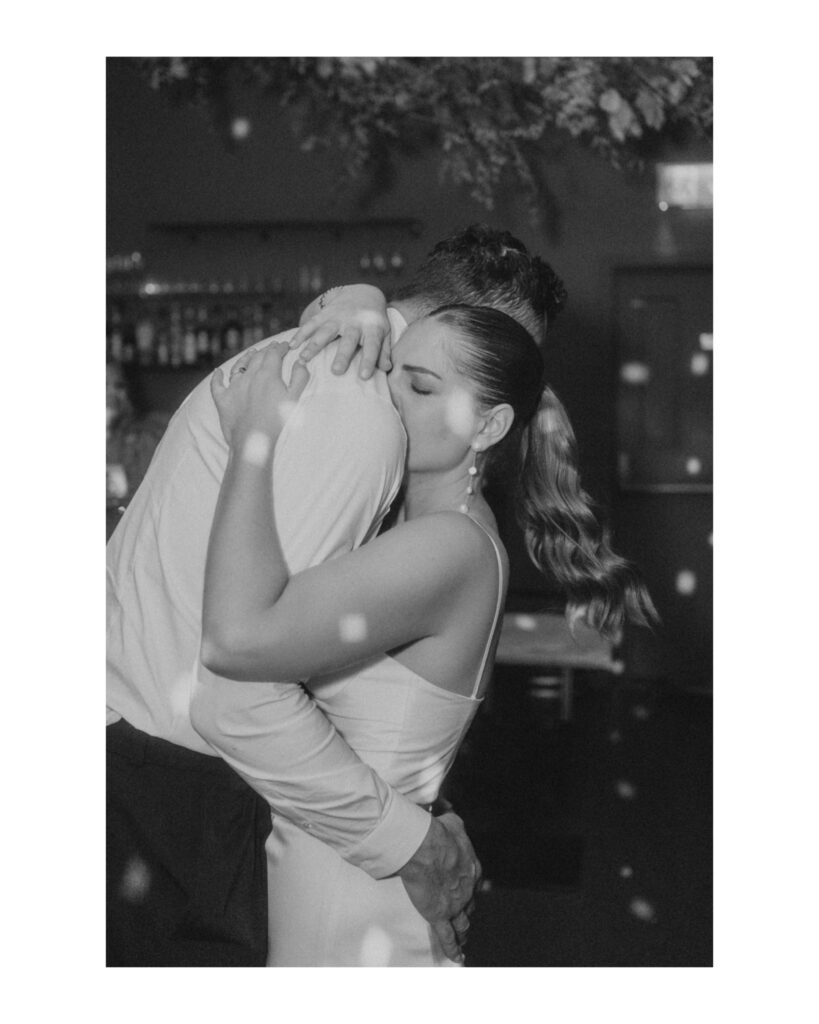 Couple hugging while dancing on their wedding day. Photo by London Wedding Photographer, Pia Bacino