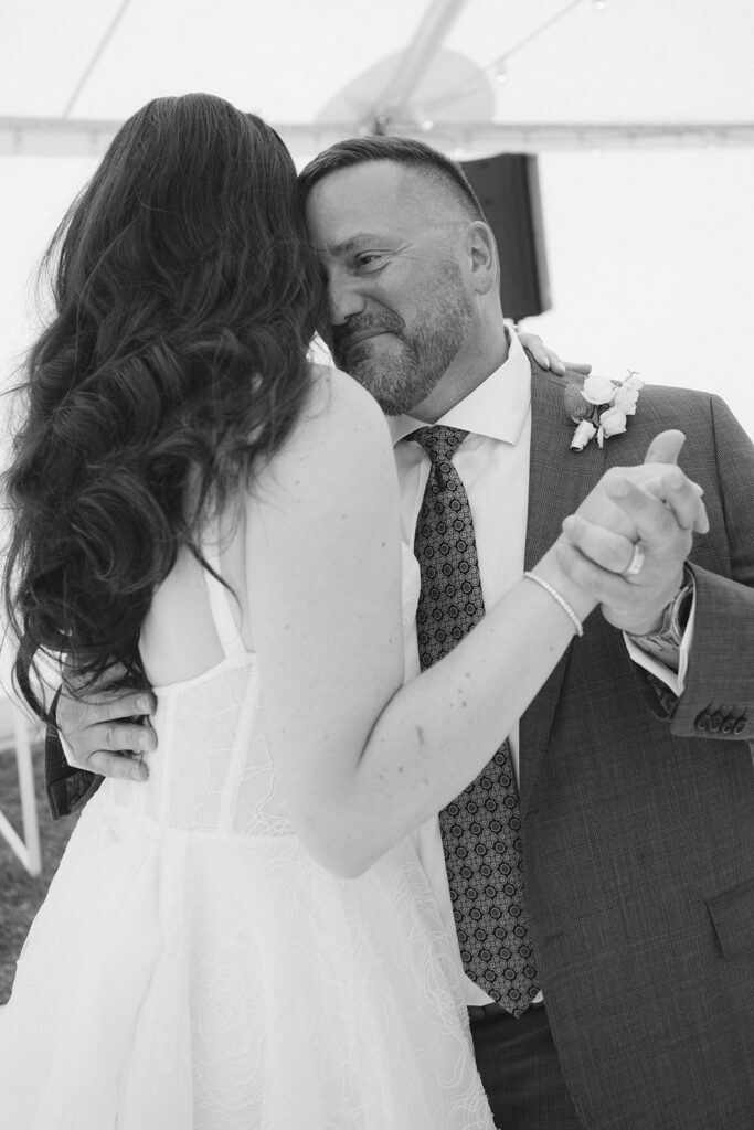 Bride dances with her emotional Dad for Father Daughter dance wedding at Poderi Crisci