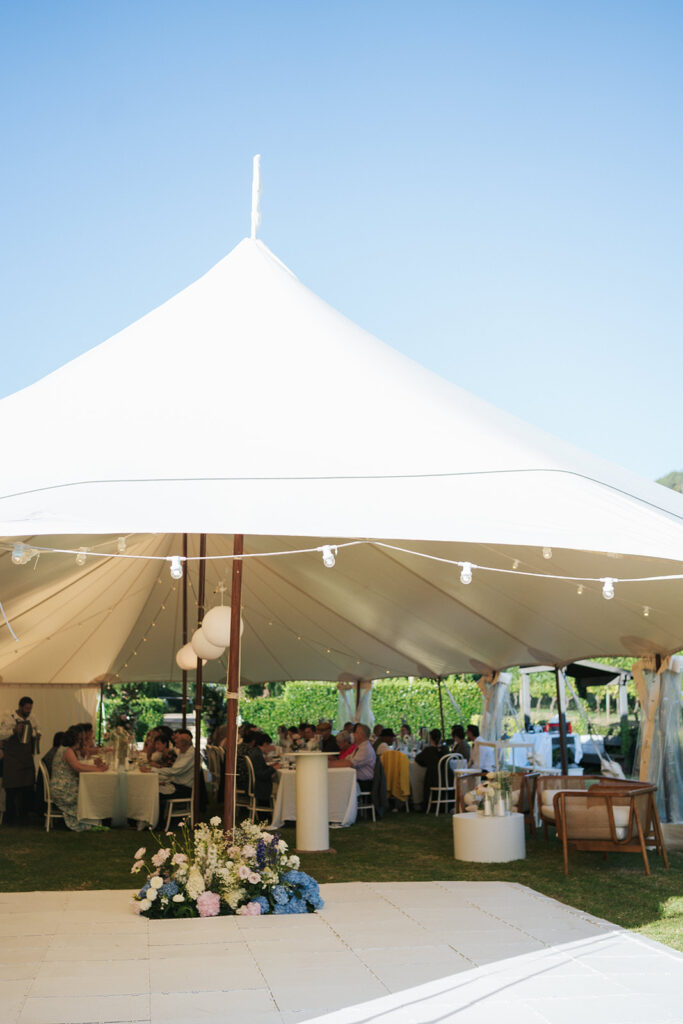 Tipi Tent adorned with florals for  wedding at Poderi Crisci